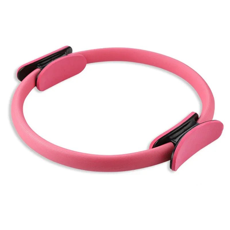 Pink Pilates ring with black accents for elegant fitness routines