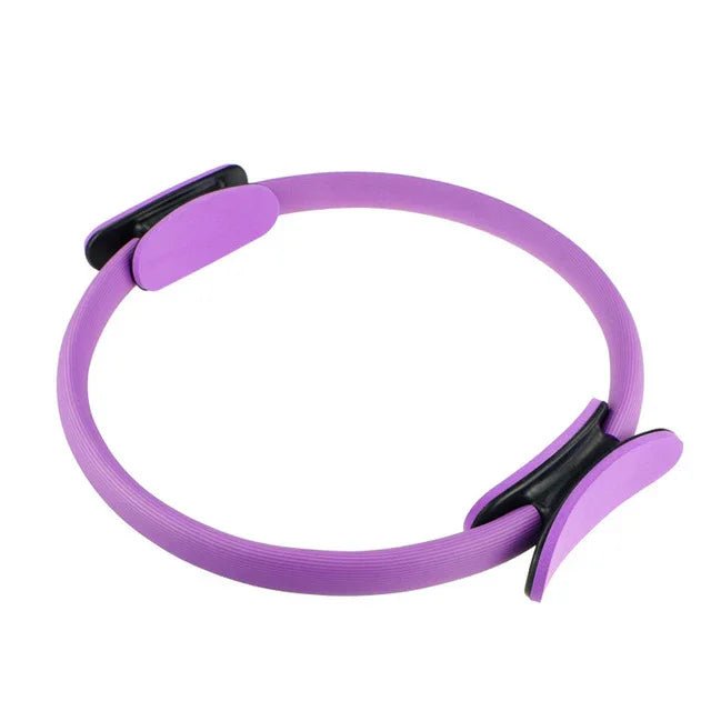 Purple Pilates ring with black grips for elegant fitness routines