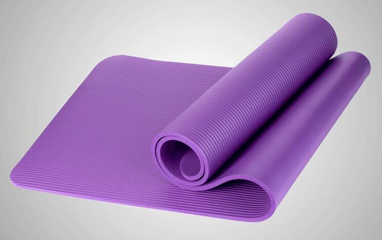 Elegant purple yoga mat with textured grip, perfect for mindful practice and serene wellness routines.