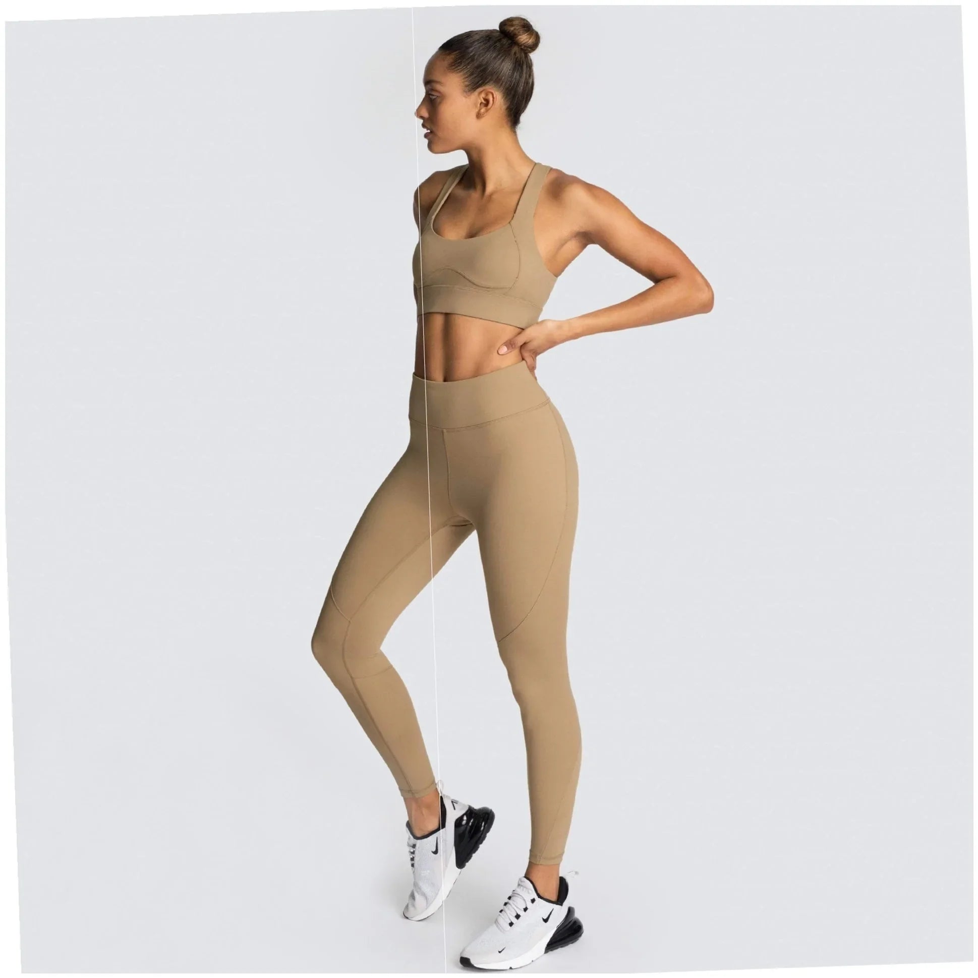 Woman in elegant beige activewear set with high-waisted leggings and sports bra, styled for faith-inspired fitness