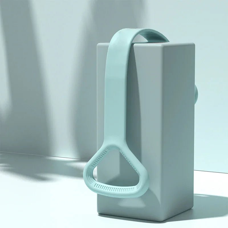 Elegant mint resistance band loop on minimalist block, perfect for faith-inspired fitness routines.